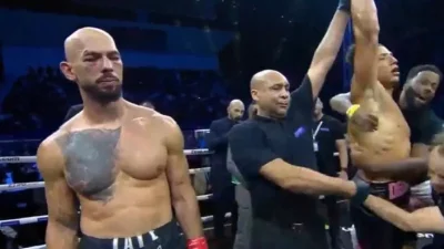 Papileo - Adrew przegrał walkę, to po pierwsze.
Dlaczego? Dlatego.
TATE  to od tyłu E...