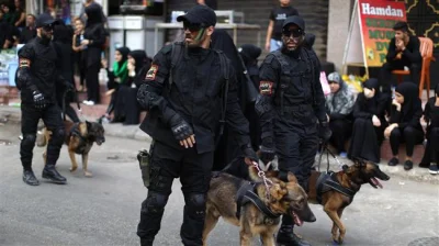 Martwiak - This file photo, taken on October 1, 2017, shows members of Hezbollah's K9...