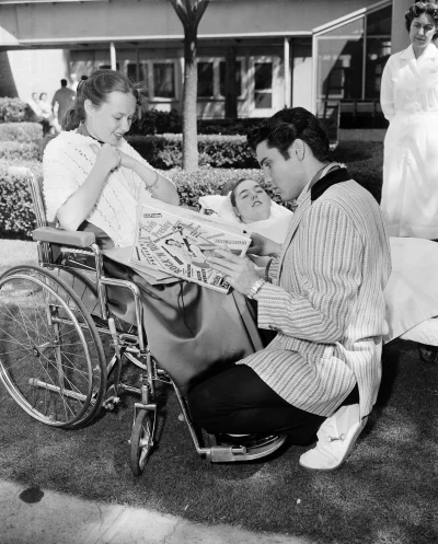 myrmekochoria - Singer Elvis Presley meets polio victims Beth Currier, left, and Elai...