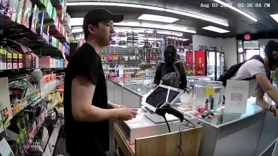 Eliade - A robber in black bloc was stabbed & subdued by an Asian-American shop keepe...