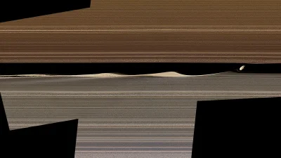 RozkalibrowanaTurbopompa - Księżyc Saturna, Daphnis, orbituje w szczelinie między dwo...