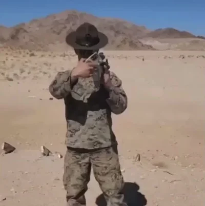 cheeseandonion - >US Marine uses phone to shoot an M16 with ACOG backwards and over h...