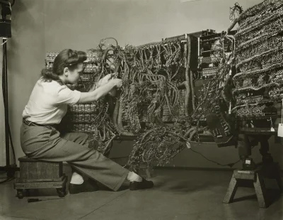 cheeseandonion - >A photo of an engineer wiring an early IBM computer, 1958 by Bereni...