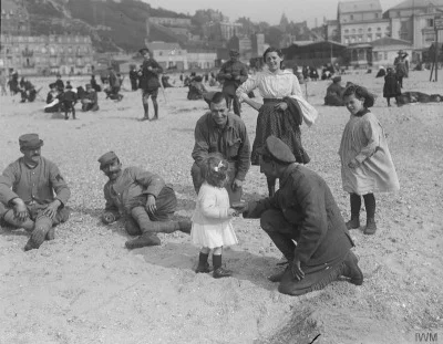 r.....e - French, American and British troops playing with civilian children on Boulo...