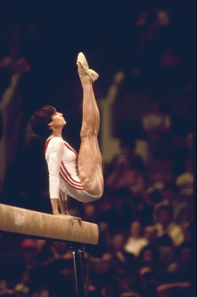 Lizus_Chytrus - > Nadia Comăneci performs on the balance beam during the 1976 Olympic...