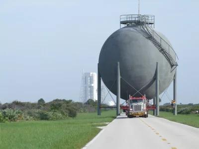 Dru - > Extra Wide Load - A flatbed truck delivers a 125,000 gallon Liquid Oxygen Tan...