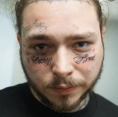 m.....o - Nowy tatuaż Post Malone'a na twarzy, w sumie to jego ryjek i może robić co ...