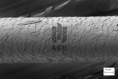 uysy - Logo #AGH wycięte na rzęsie przy pomocy działa jonowego zamontowanego w skanin...