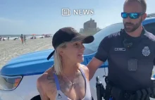 Akrobatka w kajdankach na plaży za noszenie bikini [VIDEO]