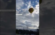 Balon uderza w linię wysokiego napięcia.