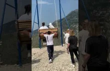 Terrifying moment two women fall off a swing on the edge of a 6,300ft...