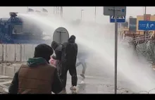 Poland: migrants vs water cannons