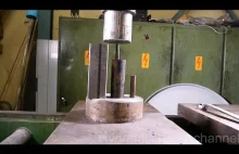 Crushing metal pipes with hydraulic press