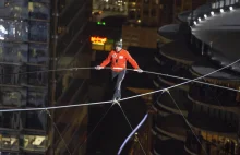 Nik Wallenda survives blindfolded tightrope walk between Chicago skyscrapers.