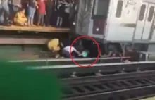 Mężczyzna rzucił się pod pociąg z 5-letnią córką w ramionach