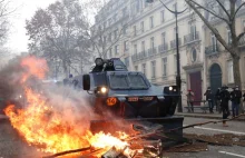 Pojazdy opancerzone na ulicach Paryża-Macron się schował do wtorku. Jest gorąco