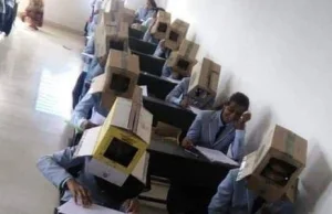 Studenci pisali egzamin z pudłami na głowach. Uczelnia przeprasza