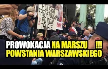 Prowokacja na marszu Powstania Warszawskiego - policja wynosi blokujących.