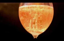 Satisfying colored oil in champagne glass.