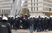 Paweł Kasprzak, szef Obywateli RU wyniesiony przez policję za blokowanie marszu