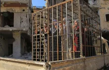 Ghuta: rebelianci więzili w klatkach, bili, mordowali i torturowali cywilów