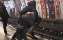 Moment two drunken men nearly hit by Tube