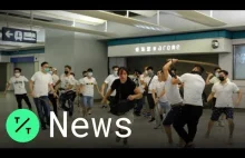 Hong Kong Protesters Attacked by Men in White at Train Station Near China...